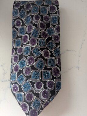This Robert Talbott Studio tie 100% silk Purple geometric spiral pattern 3.5"